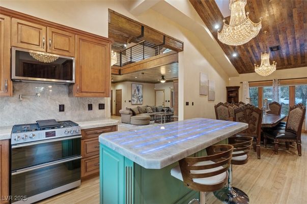 Chandelier, Dining room, Interior, Kitchen, Living room, Recessed Lighting, Stainless Steel Appliances, Wooden Beams, Wooden Ceilings, Wood Texture Flooring