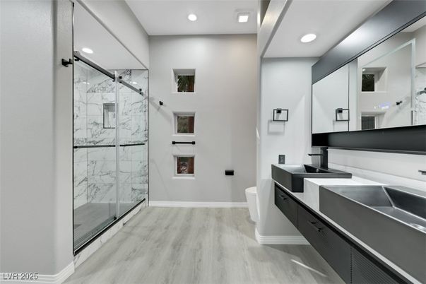 Bathroom, Glass Shower, Interior, Marble Walls, Recessed Lighting, Wood Texture Flooring