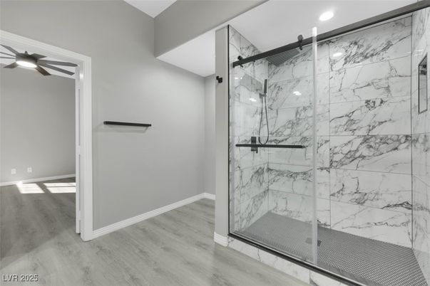 Bathroom, Glass Shower, Interior, Marble Walls, Recessed Lighting, Wood Texture Flooring