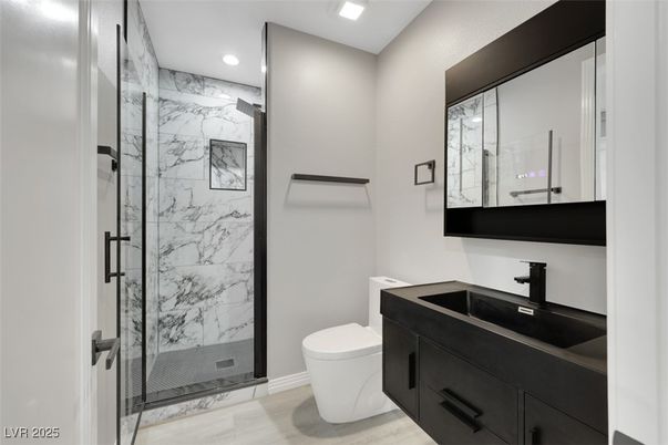 Bathroom, Glass Shower, Interior, Marble Walls, Recessed Lighting, Wood Texture Flooring