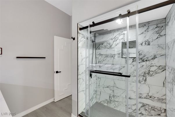 Bathroom, Glass Shower, Interior, Marble Walls, Wood Texture Flooring