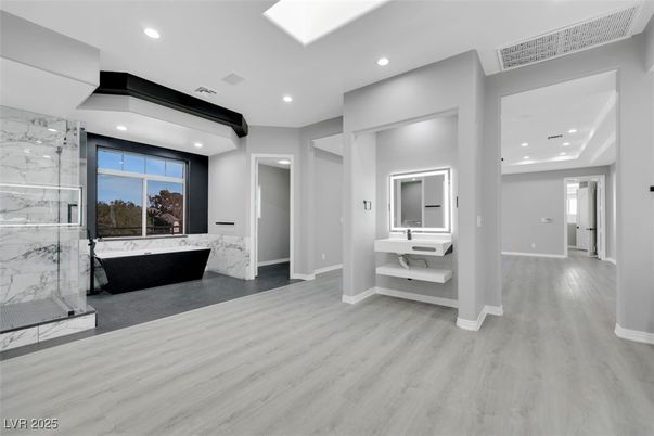 Bathroom, Glass Shower, Interior, Marble Walls, Recessed Lighting, Wood Texture Flooring