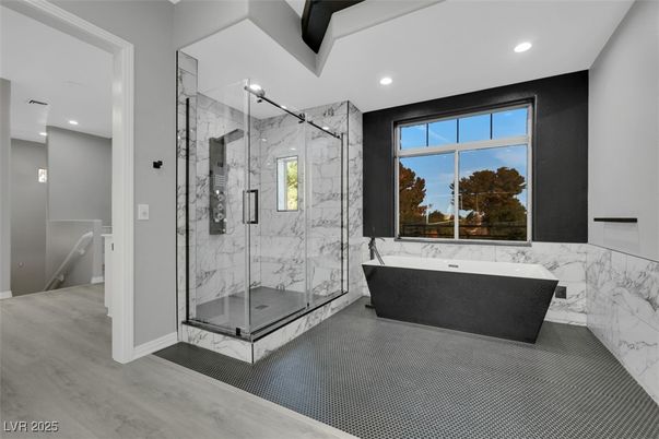 Bathroom, Free Standing Baths, Glass Shower, Interior, Marble Walls, Recessed Lighting, Wood Texture Flooring