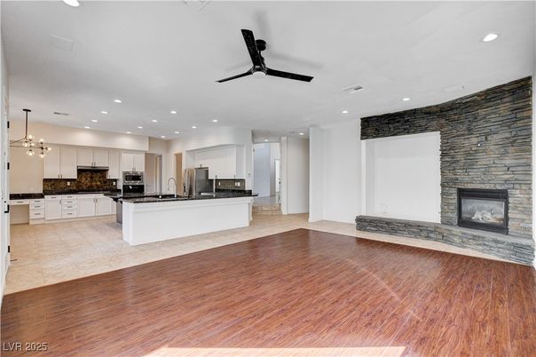 Fireplace, Interior, Kitchen, Pendant Lights, Recessed Lighting, Stone Walls, Wood Texture Flooring