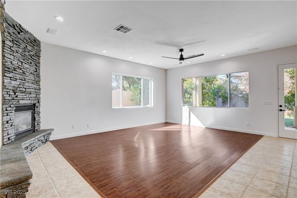 Empty room, Fireplace, Interior, Recessed Lighting, Stone Walls, Wood Texture Flooring