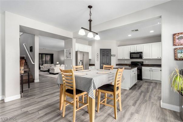Dining room, Interior, Kitchen, Living room, Pendant Lights, Recessed Lighting, Stainless Steel Appliances, Wood Texture Flooring