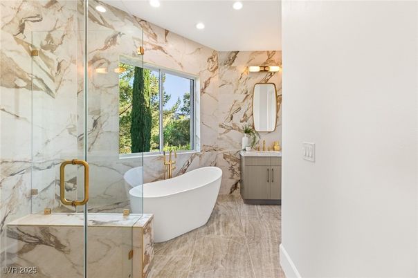 Bathroom, Dual Sink Vanities, Free Standing Baths, Glass Shower, Interior, Marble Walls, Recessed Lighting