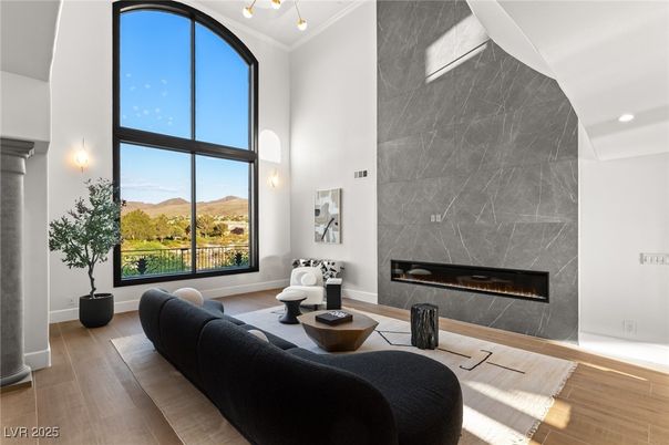 Fireplace, Interior, Living room, Marble Walls, Recessed Lighting, Wood Texture Flooring