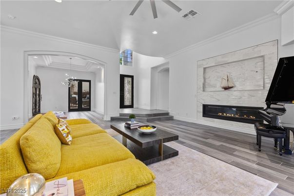 Chandelier, Fireplace, Interior, Living room, Piano, Recessed Lighting, Wood Texture Flooring