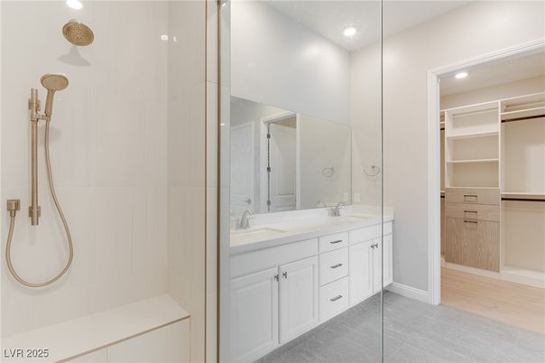 Bathroom, Dual Sink Vanities, Interior, Recessed Lighting, Walk-in Closets, Wood Texture Flooring