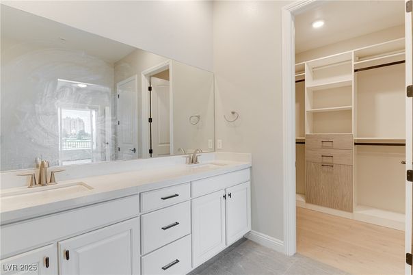 Bathroom, Dual Sink Vanities, Glass Shower, Interior, Recessed Lighting, Walk-in Closets, Wood Texture Flooring