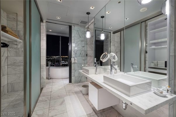 Bathroom, Dual Sink Vanities, Glass Shower, Interior, Marble, Marble Walls, Pendant Lights, Recessed Lighting