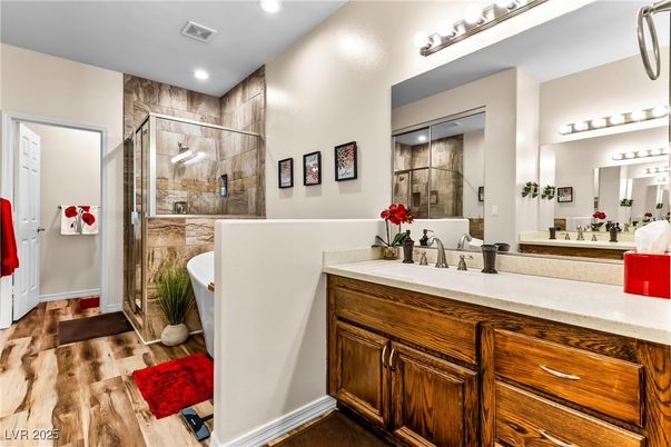 Bathroom, Dual Sink Vanities, Glass Shower, Interior, Recessed Lighting, Wood Texture Flooring