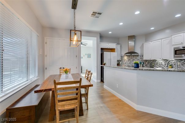 Dining room, Interior, Kitchen, Pendant Lights, Recessed Lighting, Stainless Steel Appliances, Wood Texture Flooring