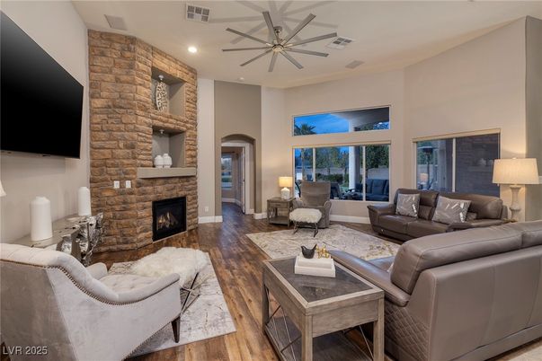 Fireplace, Interior, Living room, Recessed Lighting, Stone Walls, Wood Texture Flooring