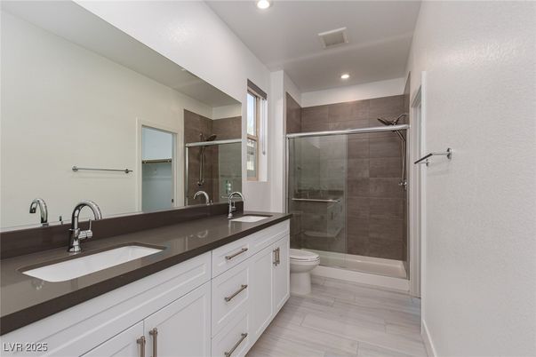 Bathroom, Dual Sink Vanities, Glass Shower, Interior, Recessed Lighting, Wood Texture Flooring
