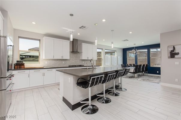Dining room, Interior, Kitchen, Pendant Lights, Recessed Lighting, Stainless Steel Appliances, Wood Texture Flooring
