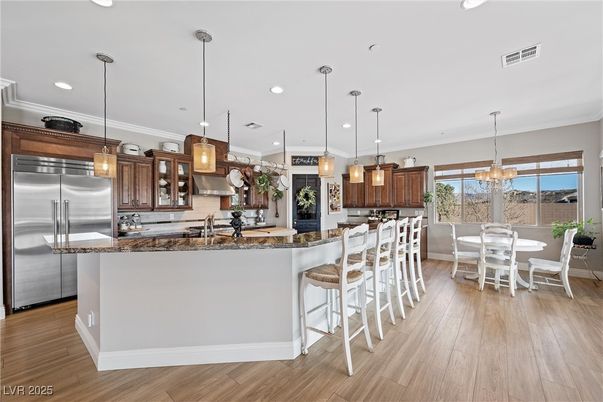 Chandelier, Dining room, Interior, Kitchen, Pendant Lights, Recessed Lighting, Stainless Steel Appliances, Wood Texture Flooring