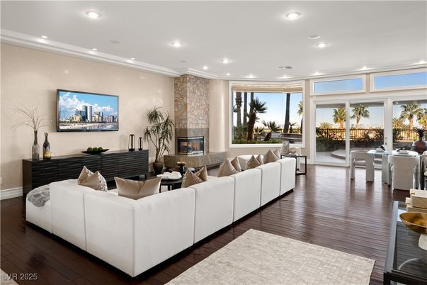 Dining room, Fireplace, Interior, Living room, Recessed Lighting, Stone Walls, Wood Texture Flooring
