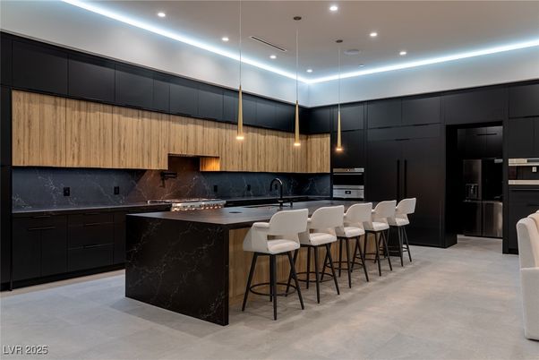 Interior, Kitchen, Marble Walls, Pendant Lights, Recessed Lighting, Stainless Steel Appliances