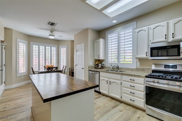 Dining room, Interior, Kitchen, Recessed Lighting, Stainless Steel Appliances, Wood Texture Flooring