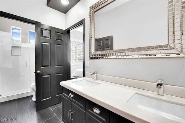 Bathroom, Dual Sink Vanities, Glass Shower, Interior, Recessed Lighting, Wood Texture Flooring