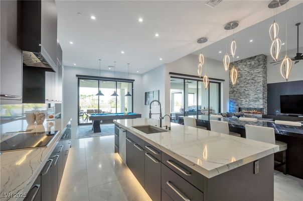 Fireplace, Interior, Kitchen, Living room, Pendant Lights, Recessed Lighting, Stainless Steel Appliances, Stone Walls