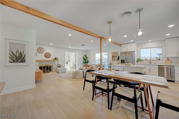 Dining room, Fireplace, Interior, Kitchen, Living room, Pendant Lights, Recessed Lighting, Stainless Steel Appliances, Wood Texture Flooring