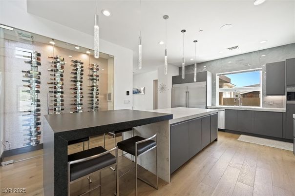 Interior, Kitchen, Pendant Lights, Recessed Lighting, Stainless Steel Appliances, Wine Storage, Wood Texture Flooring