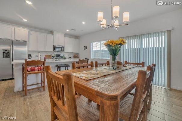 Chandelier, Dining room, Interior, Kitchen, Recessed Lighting, Stainless Steel Appliances, Wood Texture Flooring