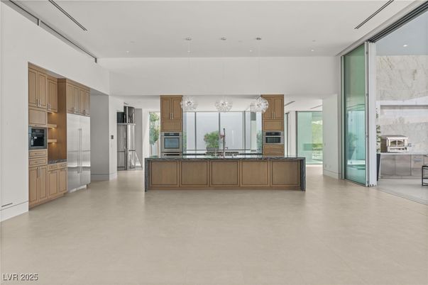 Interior, Kitchen, Marble Walls, Pendant Lights, Recessed Lighting, Stainless Steel Appliances