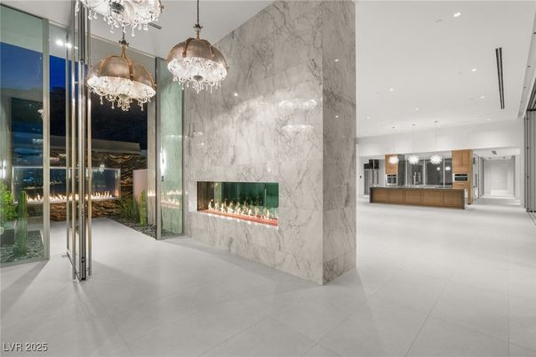 Fireplace, Interior, Kitchen, Marble Walls, Pendant Lights, Recessed Lighting, Stainless Steel Appliances
