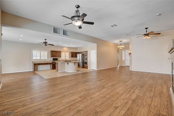 Chandelier, Empty room, Interior, Kitchen, Recessed Lighting, Stainless Steel Appliances, Wood Texture Flooring