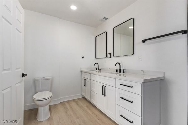 Bathroom, Dual Sink Vanities, Interior, Recessed Lighting, Wood Texture Flooring