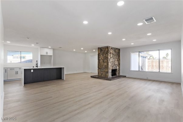 Empty room, Fireplace, Interior, Kitchen, Recessed Lighting, Wood Texture Flooring
