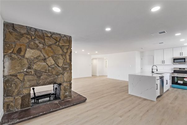 Interior, Kitchen, Recessed Lighting, Stainless Steel Appliances, Stone Walls, Wood Texture Flooring