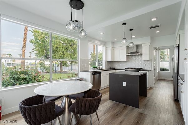 Dining room, Interior, Kitchen, Pendant Lights, Recessed Lighting, Stainless Steel Appliances, Wood Texture Flooring