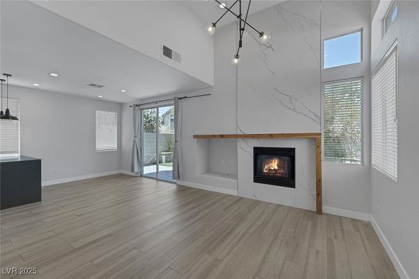 Empty room, Fireplace, Interior, Marble Walls, Pendant Lights, Recessed Lighting, Wood Texture Flooring