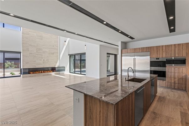 Fireplace, Interior, Kitchen, Pendant Lights, Recessed Lighting, Stainless Steel Appliances, Wood Texture Flooring