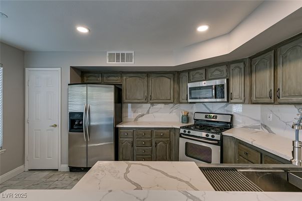 Interior, Kitchen, Marble, Marble Walls, Recessed Lighting, Stainless Steel Appliances