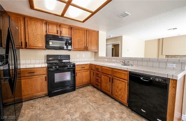 Interior, Kitchen, Recessed Lighting, Tile Countertops