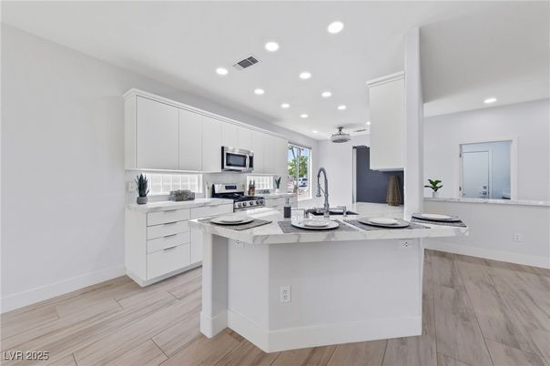 Interior, Kitchen, Recessed Lighting, Stainless Steel Appliances, Wood Texture Flooring