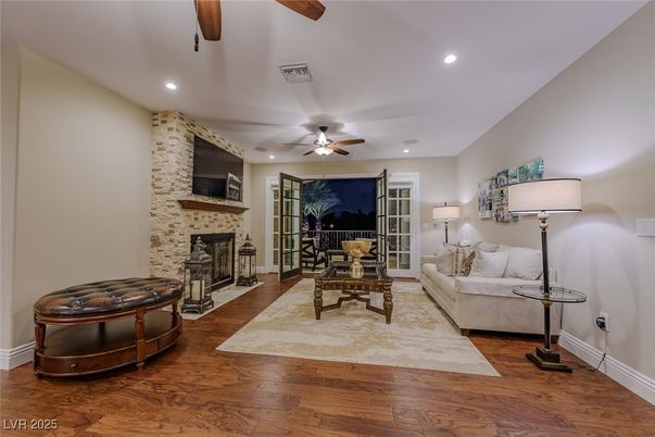Fireplace, Interior, Living room, Recessed Lighting, Stone Walls, Wood Texture Flooring