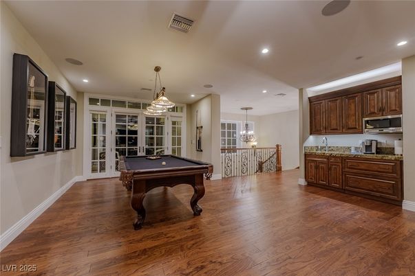 Billiard Table, Chandelier, Game Room, Interior, Pendant Lights, Recessed Lighting, Wood Texture Flooring