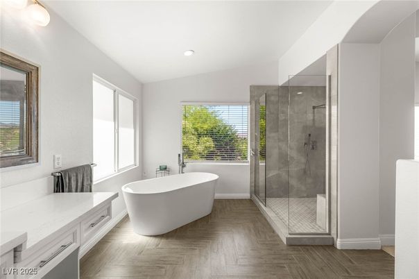 Bathroom, Free Standing Baths, Glass Shower, Interior, Recessed Lighting, Wood Texture Flooring