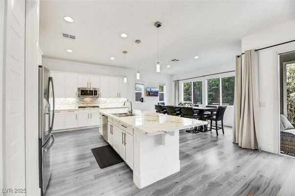 Dining room, Interior, Kitchen, Pendant Lights, Recessed Lighting, Stainless Steel Appliances, Wood Texture Flooring