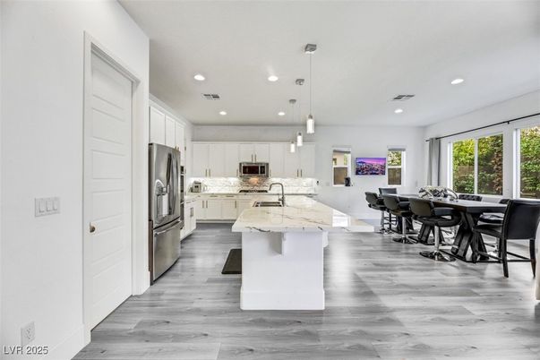 Dining room, Interior, Kitchen, Pendant Lights, Recessed Lighting, Stainless Steel Appliances, Wood Texture Flooring