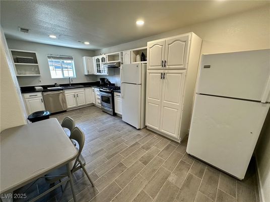 Dining room, Interior, Kitchen, Recessed Lighting, Stainless Steel Appliances, Wood Texture Flooring