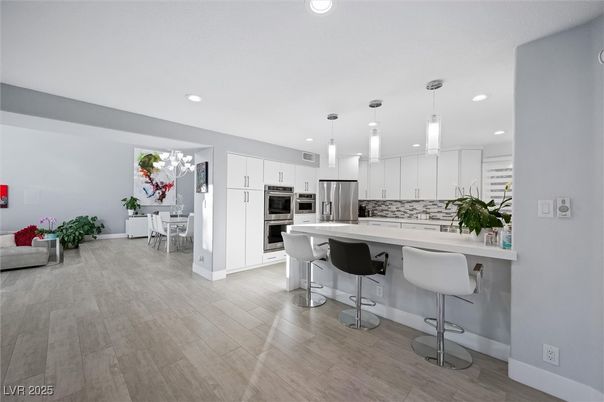 Dining room, Interior, Kitchen, Pendant Lights, Recessed Lighting, Stainless Steel Appliances, Wood Texture Flooring