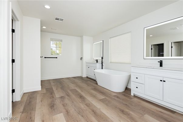 Bathroom, Dual Sink Vanities, Free Standing Baths, Interior, Recessed Lighting, Wood Texture Flooring
